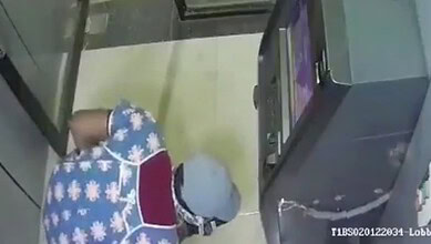Men in nighties using gas cutter to loot ATM in Kamareddy at night.