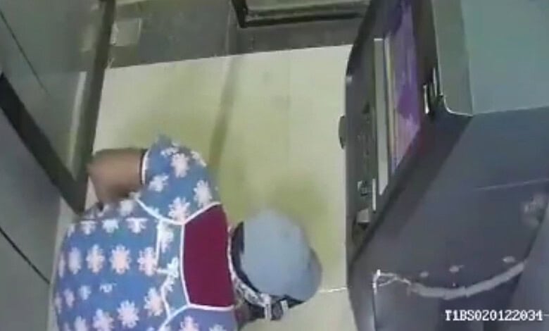 Men in nighties using gas cutter to loot ATM in Kamareddy at night.