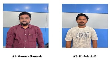 Two men, Gumma Ramesh and Mudale Anil, standing against a blue and white wall.