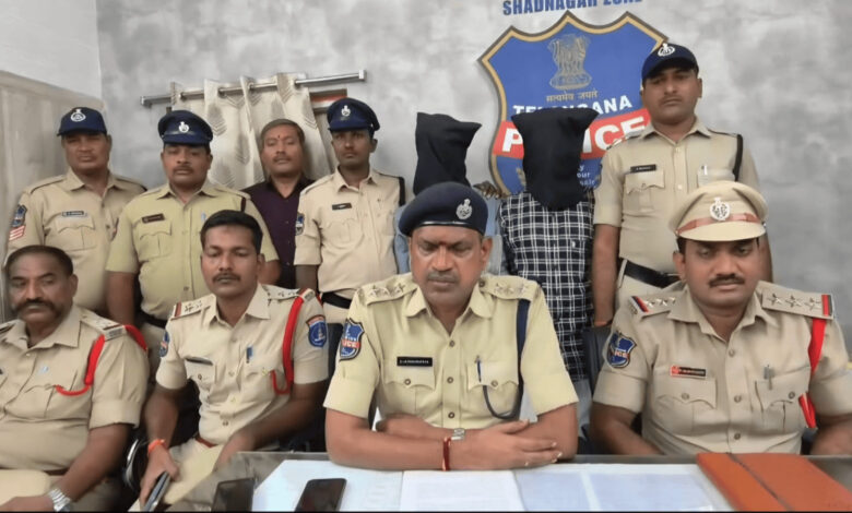 Police officers and a suspect with a hood in front of a police badge at Future City police station.