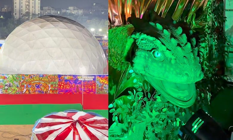 Colorful carnival scene with a large geodesic dome and a green-lit dinosaur figure.