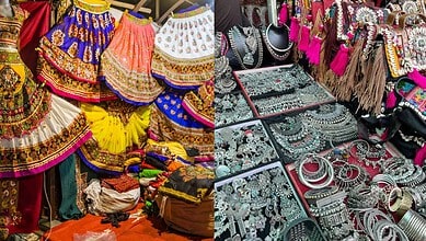Colorful traditional Indian jewelry and clothing displayed at a market stall.