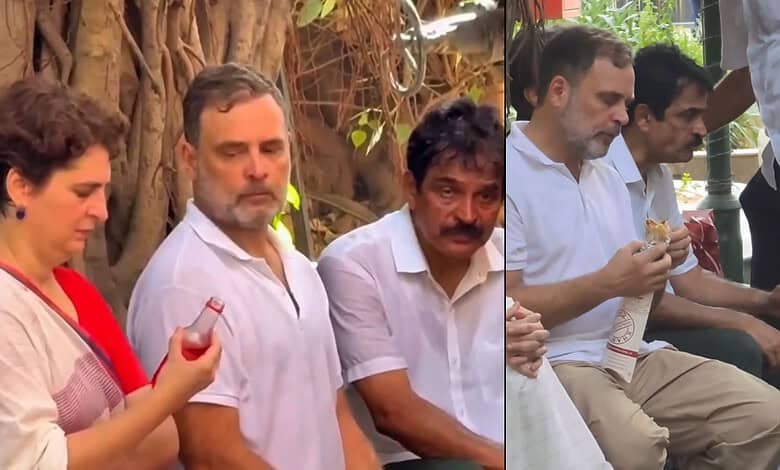Rahul Gandhi with a group of people outdoors, engaging in conversation and holding snacks.