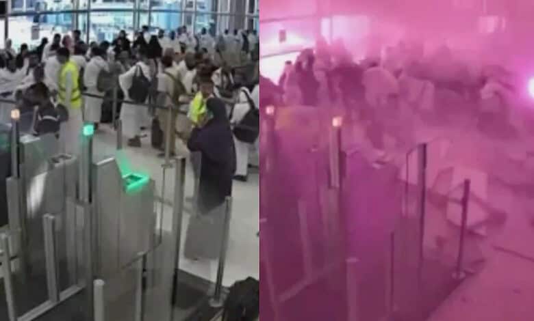 Crowd of pilgrims and airport staff during strike at Riyadh airport with pink smoke in background.