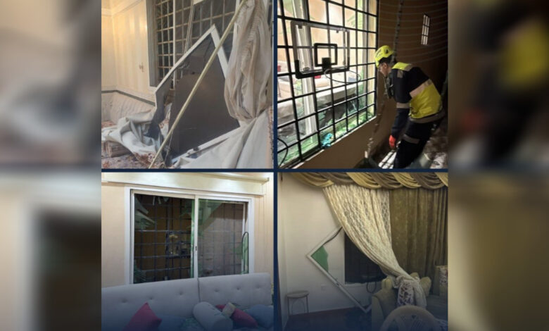 Rescue workers inspect damage after missile attack at Saudi Aramco building in Riyadh.