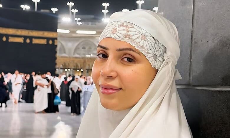 Rozlyn Khan wearing a white hijab at a crowded public gathering.