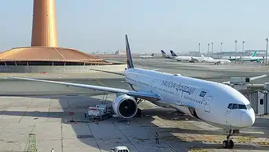 Passenger airplane parked at Riyadh airport during extended closure amid security concerns.