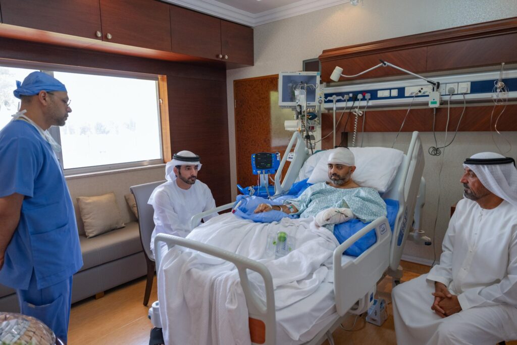 Injured Indian flydubai pilot Smit Machchhar in hospital with Sheikh Hamdan visiting.