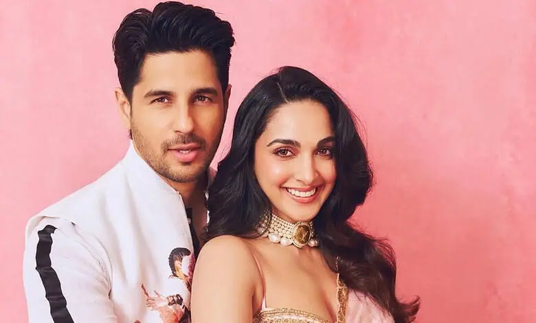 Kiara Advani and Siddharth Malhotra smiling together against a pink background.