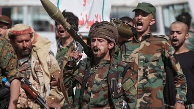 Yemen’s Houthi fighters march during a mobilisation campaign in Sanaa.